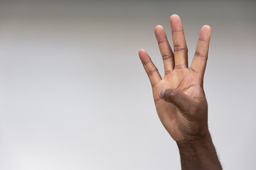 Hand of black African Man Pointing Up four fingers Gesture for number 4, Success, Goal, Direction concept on Isolated Background