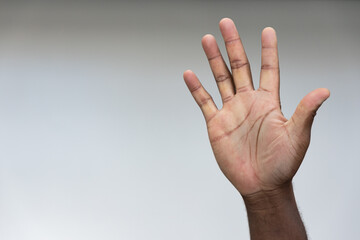 Hand of black African Man Pointing Up five fingers Gesture for number 5, Success, Goal, Direction...