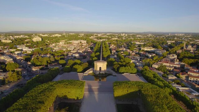 The drone aerial footage of Promenade du Peyrou garden and ancient water tower, aqueduct of arceaux in Montpellier city, France.