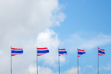 Thai flag of Thailand flag with blue sky and clouds background.