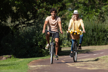 couple with bicycles in the park