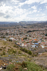 View from the scenic road to the landmark Muela del Diablo over the highest administrative capital, the city La Paz and El Alto in Bolivia