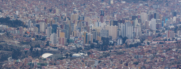 View from the scenic road to the landmark Muela del Diablo over the highest administrative capital, the city La Paz and El Alto in Bolivia - close up of hundreds of houses and skyscrapers - Panorama