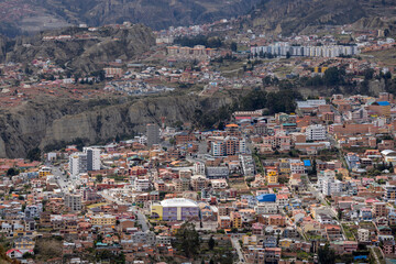 View from the scenic road to the landmark Muela del Diablo over the highest administrative capital, the city La Paz and El Alto in Bolivia - close up of hundreds of houses