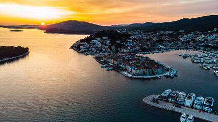 Sunset Drone areal view over islands. Church. Croatia