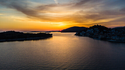 Sunset Drone areal view over islands. Church. Croatia