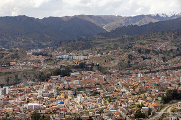 View from the scenic road to the landmark Muela del Diablo over the highest administrative capital, the city La Paz and El Alto in Bolivia