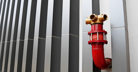 The red fire hydrant outside the building is decorated in a modern design, copy space