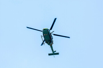 Fototapeta na wymiar Close-up of flying chopper against isolated blue sky. Indian air force chopper.