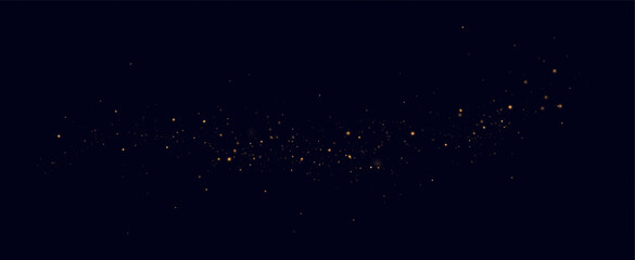 Golden sequins glow with many lights. Glittering dust. Luxurious background of golden particles.