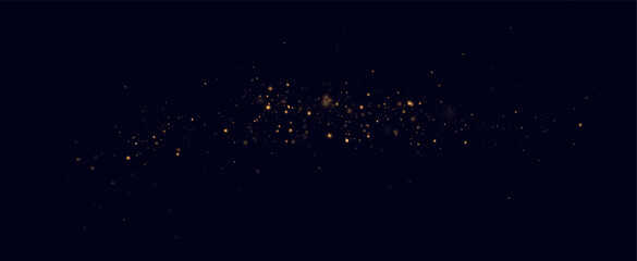 Golden sequins glow with many lights. Glittering dust. Luxurious background of golden particles.