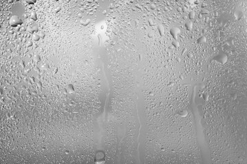 Gray background. Glass wet surface.