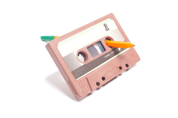 Audio cassette tape with pen side 1 isolated on white background, vintage 80's music concept.