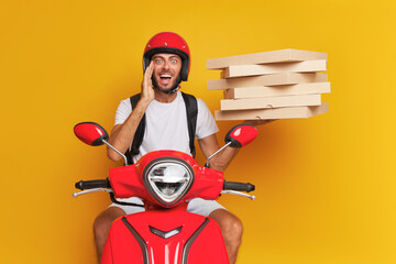 Pizza guy delivers orders to clients on red scooter, dressed in red helmet and white t-shirt...