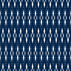 Seamless pattern with white rhombus arranged in a beautiful pattern on a blue background Used for fabric, paper or wallpaper. Vector illustration.