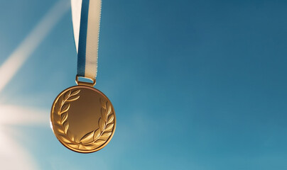 Gold medal hanging in the blue sky, winner against blue sky background copy space,sports,winning,achievement,game,sports business,success concept
