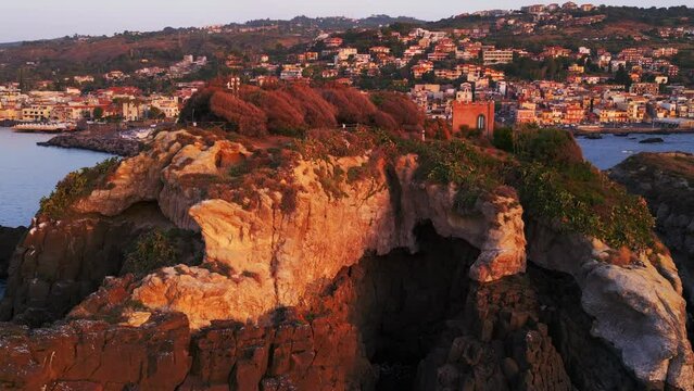Aerial view of Aci Trezza, a seaside village in the countryside near Catania in Sicily.
Traditional harbor on the cliff overlooking the stacks of the mythologyIslands of Greek mythology of Polyphemus.