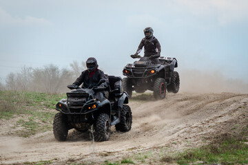 ATV and UTV offroad vehicle racing in dust. Extreme, adrenalin. 4x4