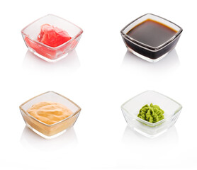 Japanese condiment for sushi. Soy sauce, wasabi, pickled ginger,  sesame sauce. Classic sauces in traditional Japanese cuisine.