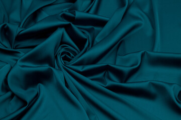 Fabric satin silk drapery. Green textile