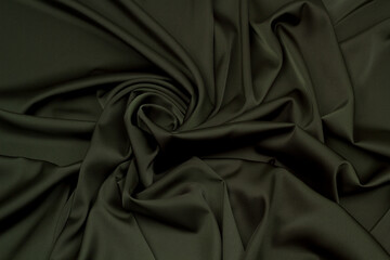 Obraz premium Fabric satin silk drapery. Green textile