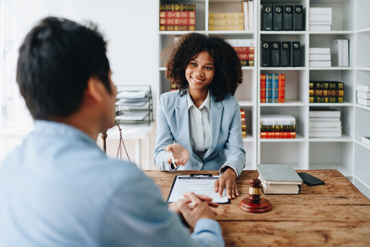african american attorney, lawyers discussing contract or business agreement at law firm office, Business people making deal document legal, justice advice service concepts