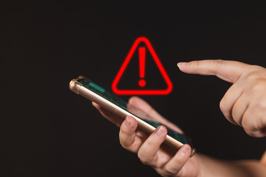 woman using smartphone with notification error. warning sign over on mobile phone. maintenance connection application. programmer, developer. security network dangerous.