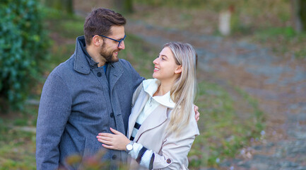 Obraz premium A portrait of a happy romantic couple walking outdoors in the surroundings of an old fortress