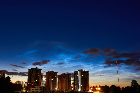 Noctilucent clouds - night shining clouds in the night sky over the city. July 2020, Russia