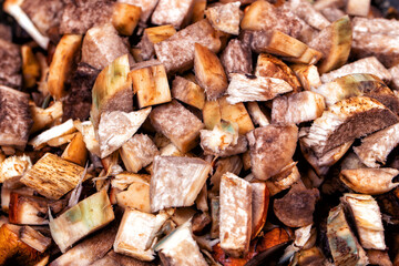 Raw chopped mushrooms in a frying pan. Close-up
