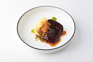 Beef cheeks. Mashed potatoes. Hearty food. Meat food. Photo on a white background for the menu. Copy space. Isolated object.