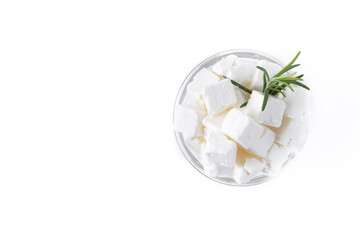 Feta cheese, cucumber and herbs in a bowl isolated on white background. Top view. Copy space