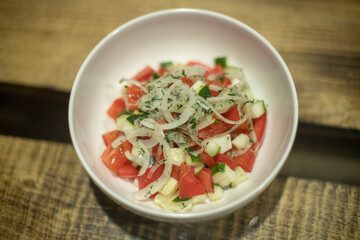 Food in white plate on table. Delicious dish. Hot dinner.