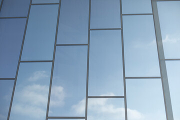 Mirror wall. Texture of building. Reflection of sky in mirrors.
