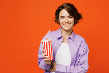 Young smiling caucasian woman she wear purple shirt white t-shirt casual clothes hold in hands cup...