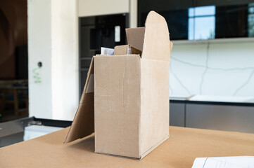 An open cardboard box. Indoor renovation