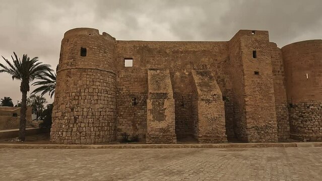 Majestic walls of Borj El Kebir castle ion Djerba island in Tunisia on cloudy