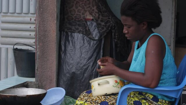 young african woman with ball of flour.