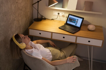 woman wearing headphones  relaxed of your apartment. concept without stress. mental health. Slow...