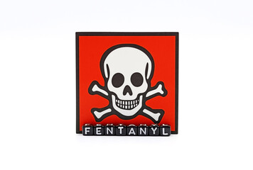 The danger of death symbol next to the word Fentanyl, a potent opioid that can cause death by overdose