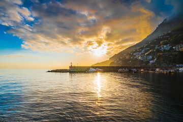 Crepuscular sun rays over Amalfi shoreline