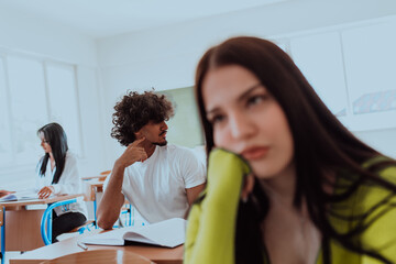 A weary-looking student sitting in front of a group of diverse students in a modern classroom, capturing the blend of exhaustion, learning, and collaboration in their academic journey