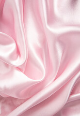 The delicate texture of the waves of pink silk satin fabric. Vertical abstract festive fabric background. background image, layout.