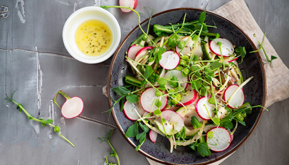 Fresh summer fennel salad with pea shoots and radishes. Top view