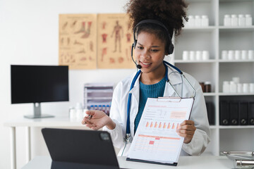 Pharmacists or doctors conducts video consultation, communicates online conference, uses laptop, diagnoses, recommended and prescribed medications, and also answers questions.