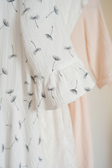 Women's clothing on hangers in the store. Close-up.