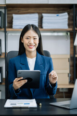 Smiling confident mature business woman leader looking at camera in office.