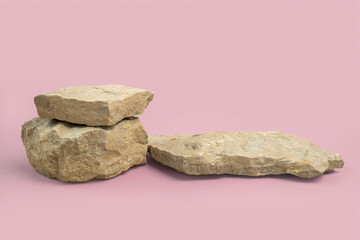 Stone podium for cosmetic product presentation. Abstract minimal backdrop. Two rock form. Pink Nude...