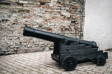 Medieval cannon in front of the old wall