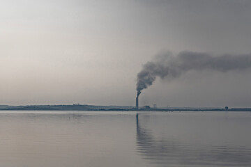 Air pollution from power plant chimneys.